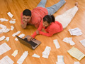 Couple paying bills for family and debt