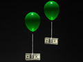 two balloons carrying 100 dollar bills 	
