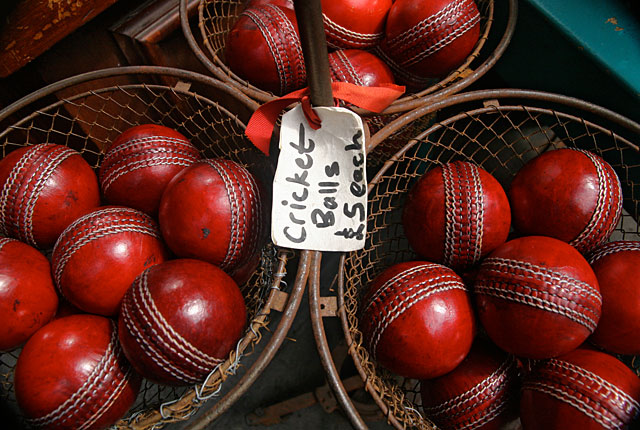 Red cricket balls in thrift store, frugal holiday season
