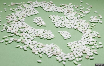Conceptual Pills in the shape of a dollar sign