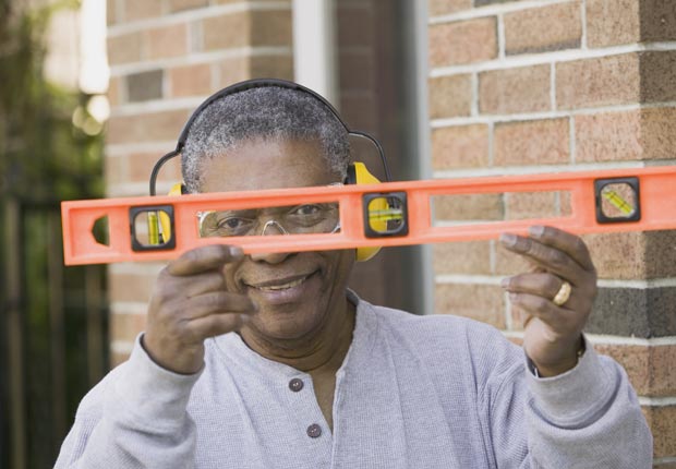 Man with construction level, Construction loans are bad to co-sign