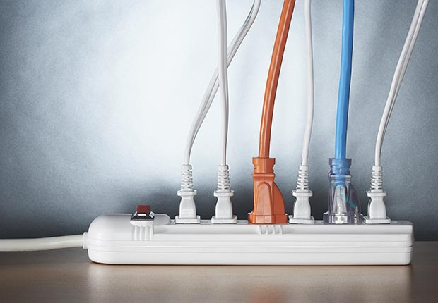 Various plugs connected to power strip