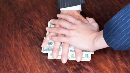 AARP's book Outsmarting the Scam Artists offers practical advice for protection- men's hands with money AARP's book Outsmarting the Scam Artists offers practical advice for protection- men's hands with money