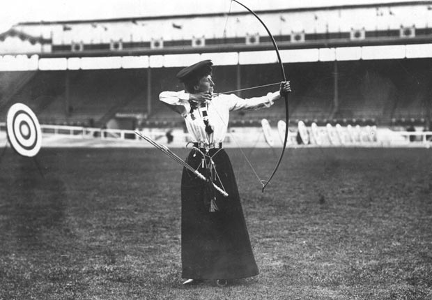 Queenie Newall positions herself to shoot an arrow with her bow