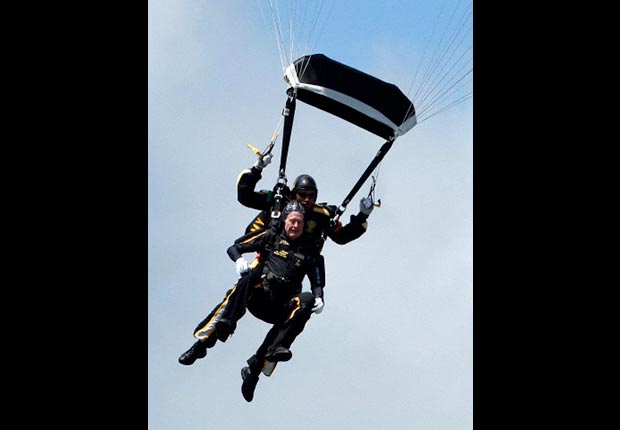 ormer President George H. W. Bush rides tandem with Army Sgt. Michael Elliott of the Army Golden Knights parachute team as he celebrates his 85th birthday with a parachute jump, Friday, June 12, 2009, in Kennebunkport, Maine.