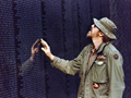 A Vietnam veteran touches the Memorial wall, little-known facts about the Vietnam Veterans Memorial