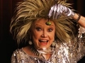 Comedienne Phyllis Diller holds olive and martini.  Diller died on August 20, 2012.