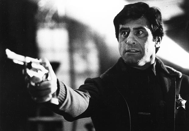 Actor James Farentino holds a gun in the movie Dead & Buried.  Farentino died on January 24, 2012.