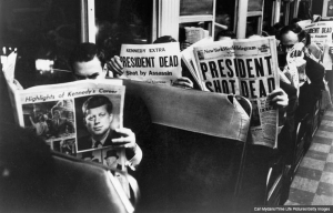 Commuters reading of John F. Kennedy's assassination, 22nd November 1963. (Carl Mydans/Time Life Pictures/Getty Images)
