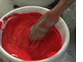 bowl of red paint