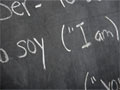 Chalkboard with written Spanish and English, English as a second language