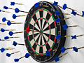 dart board with lots of missed darts