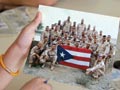 girl holding photo of soldiers in Iraq
