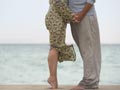 Low angle of couple on beach-4 Ways to Have Better Sex