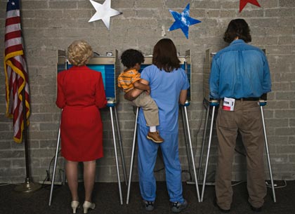 Mother with child at voting booth