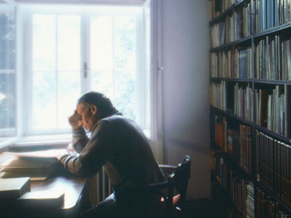 man reading in library