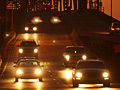 Cars pass over the Claiborne Avenue Bridge at sunset
