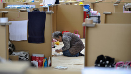 woman preparing lunch at tsunami shelter in Mikayo after the 2011 Japanese Tsunami