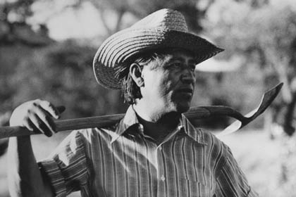 César Chávez, founder of the United Farm Workers (UFW), takes a break during work on the community garden at UFW headquarters in La Paz, California, in 1975. 