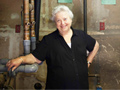 Frieda Denenmark with boiler, has hopes for Connecticut's new energy program.