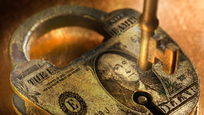 Lock with dollar bill on it- the national debt