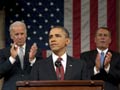 President Barack Obama, flanked by Vice President Joe Biden (L) and House Speaker John Boehner (R-OH), delivers his State of the Union address