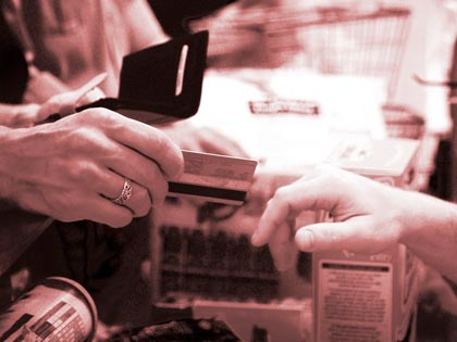 man handing his credit card man handing his credit card