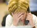 businesswoman with head in hand