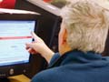 man using a computer to search for a job online 