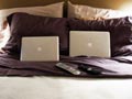 laptops on bed