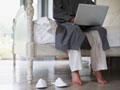 New technology allows people to access medical care at home - a man speaks with his doctor through his computer