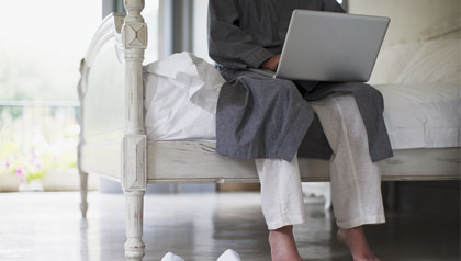 New technology allows people to access medical care at home - a man speaks with his doctor through his computer