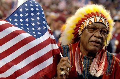 A Washington Redskins fan holds an American Flag on ESPN Monday Night Football September 11, 2006 in Washington. The Minnesota Vikings defeated the Redskins 19 - 16. (Photo by Al Messerschmidt/Getty Images) A Washington Redskins fan holds an American Flag on ESPN Monday Night Football September 11, 2006 in Washington. The Minnesota Vikings defeated the Redskins 19 - 16. (Photo by Al Messerschmidt/Getty Images)