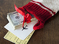Christmas stocking with airline tickets and cash - Frommers: Holiday Flight Tips