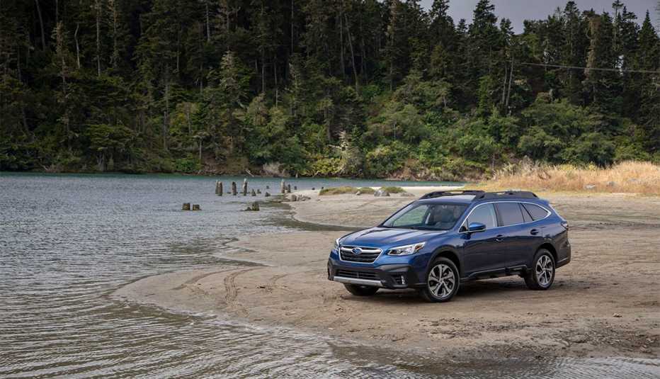 2020 blue Subaru Outback parked near a body of water