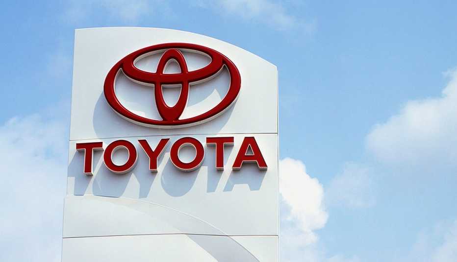 sign from a toyota car dealership that shows the toyota logo