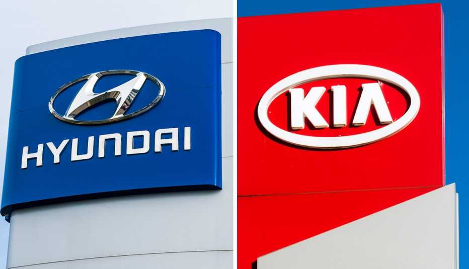 hyundai and kia car maker logos on dealership signs both car makers are recalling some twenty twenty three vehicles due to fire risk