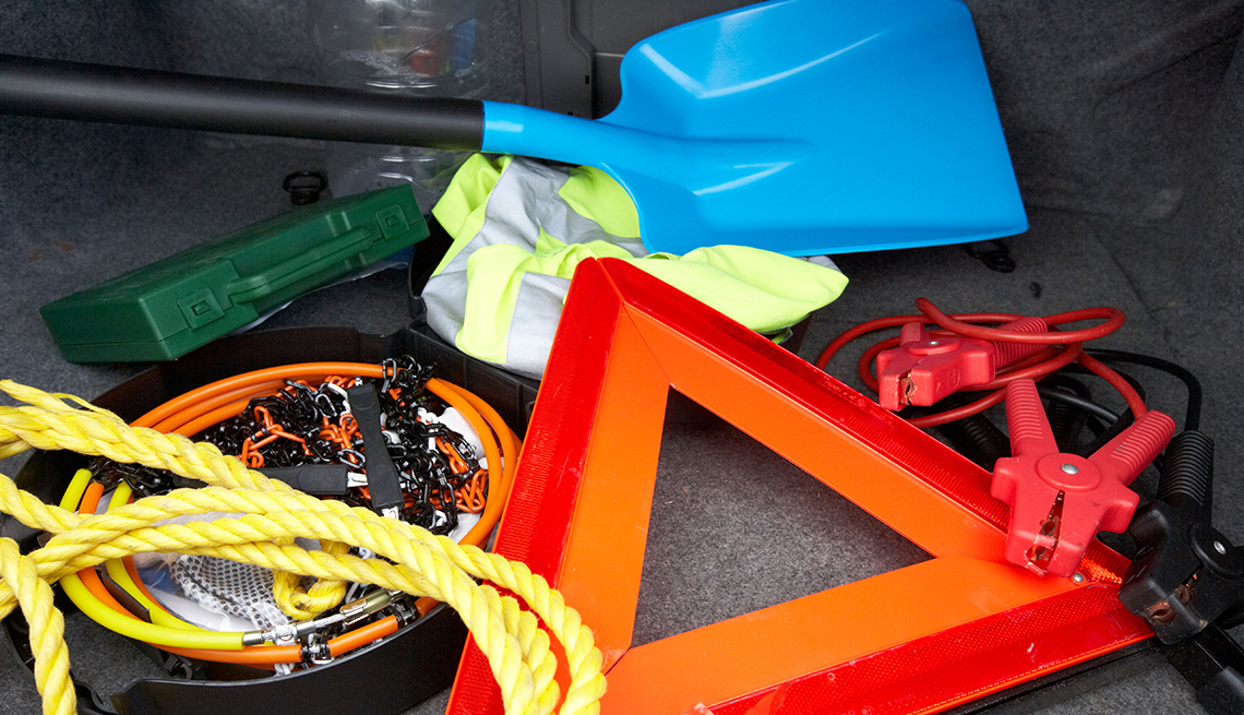 photo of shovel, jumper cable and other supplies to keep in car during winter