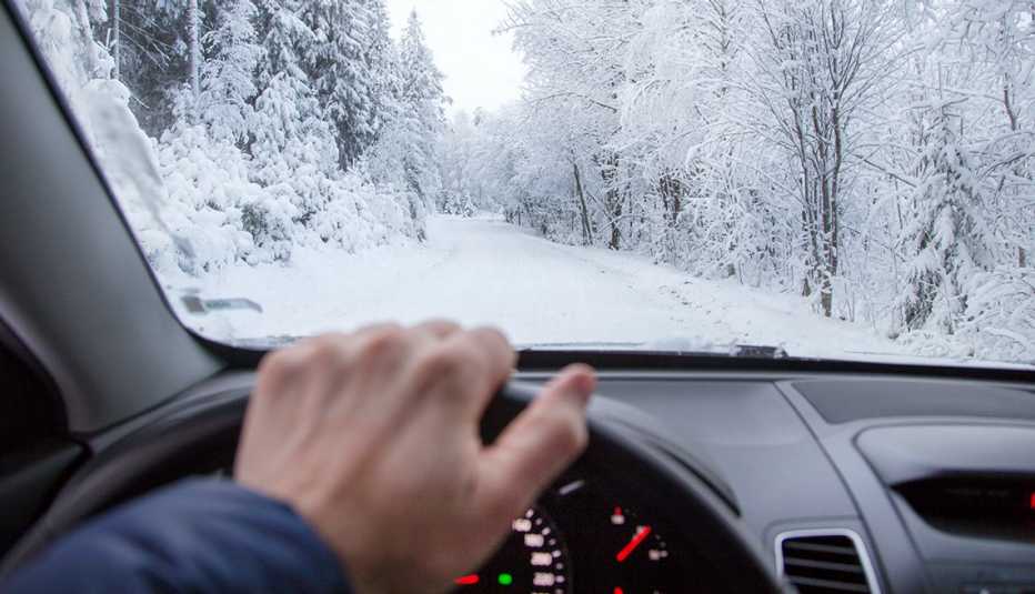 male driver, snowy road, AARP Auto, Winter Driving Tips, 