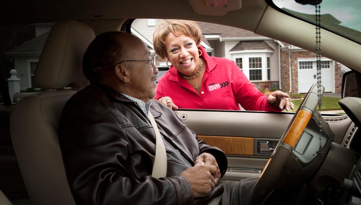 Penny Corum, a a teacher for AARP's Driver Safety Initiative, instructs her father, John Henderson, in driver safety