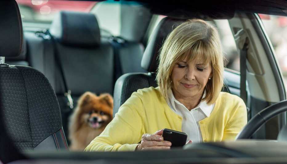 Woman Using Smartphone While Driving Car, Avoid Distractions, AARP Driver Safety