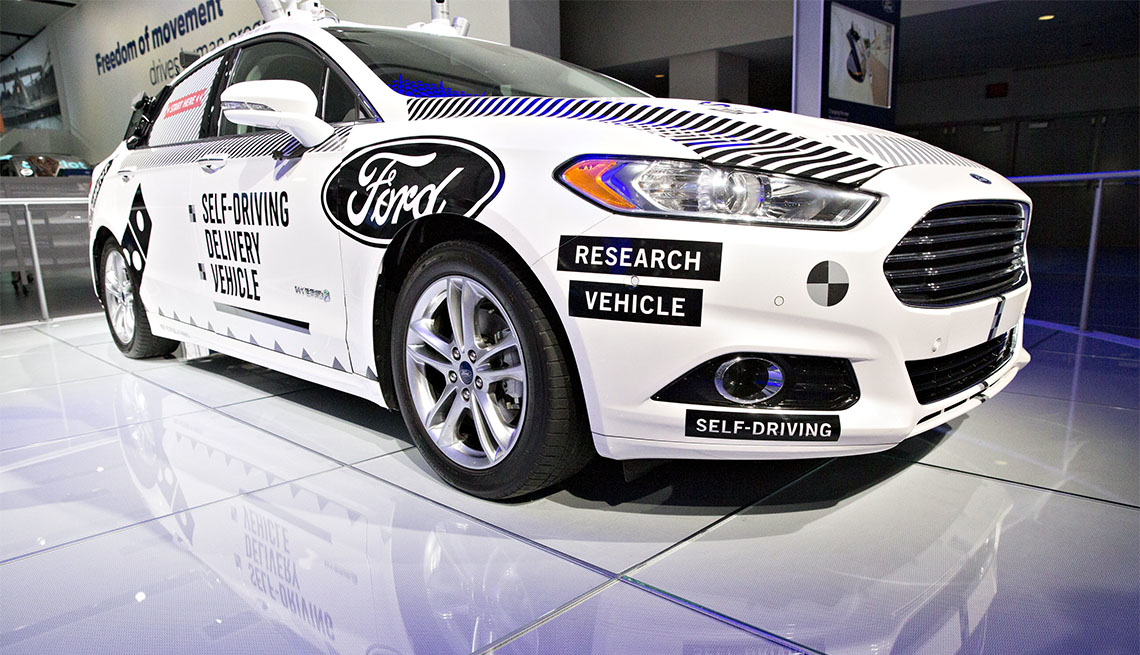 A Ford Fusion self-driving delivery vehicle at 2018 North American International Auto Show