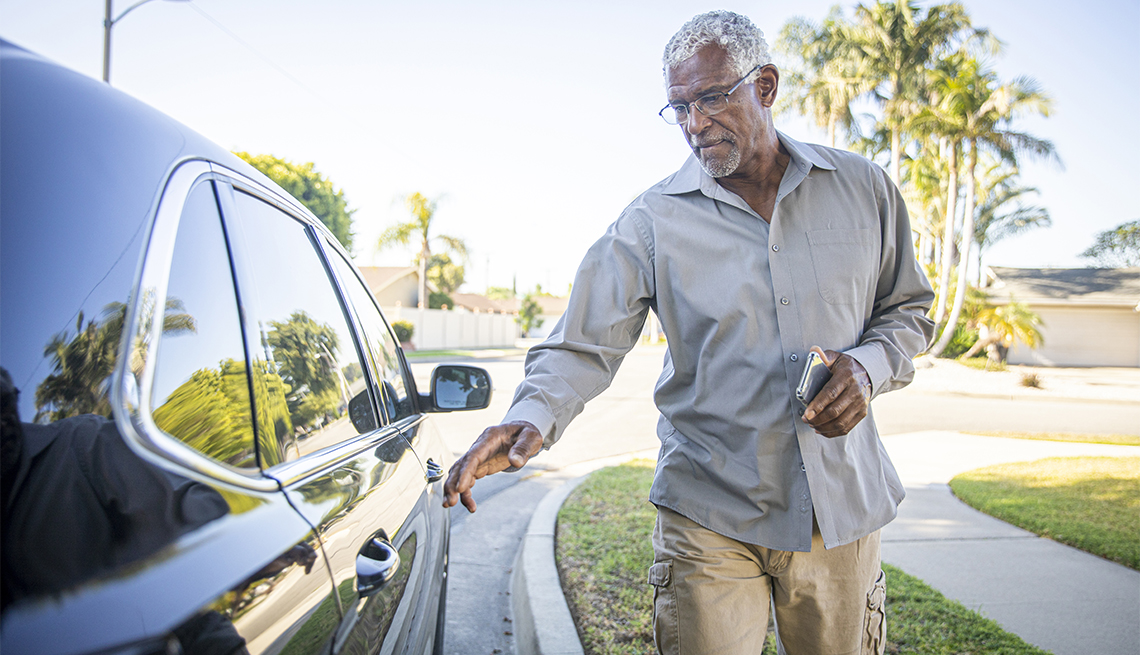 older man gets into the car that has arrived for him