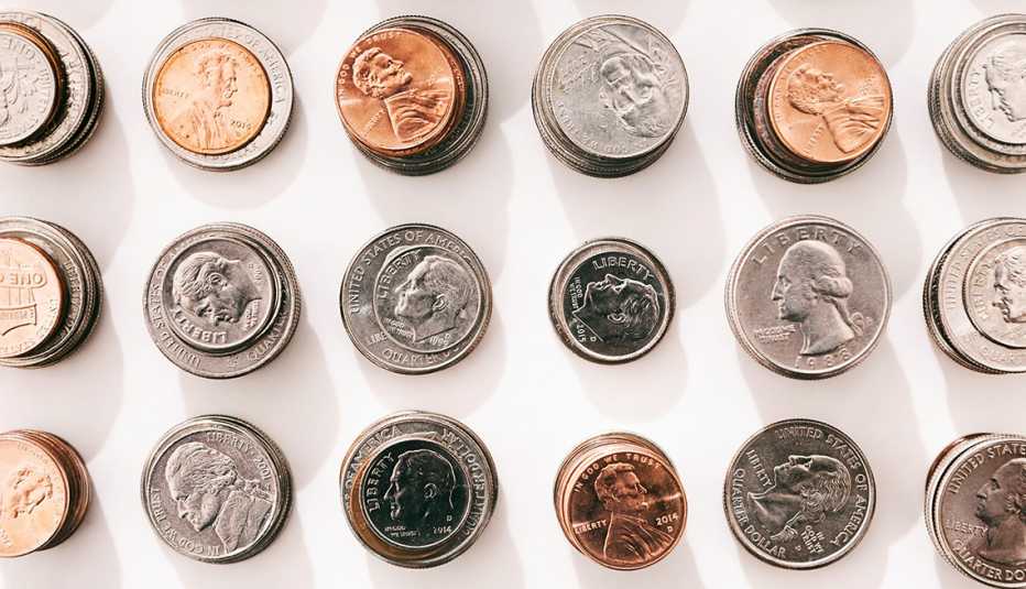 columns of u s coins of different denominations set up in stacks and photographed from above to create a pattern of rows