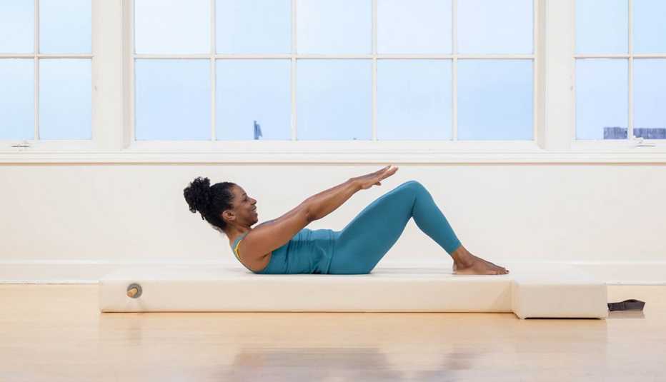Kira Lamb performs fundamental Pilates