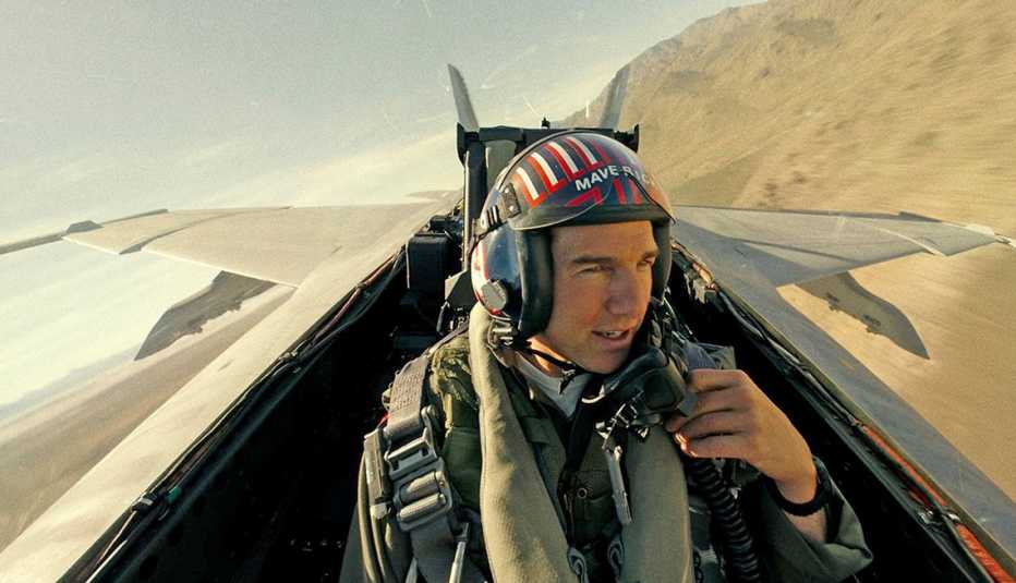tom cruise as maverick in plane in a still from top gun