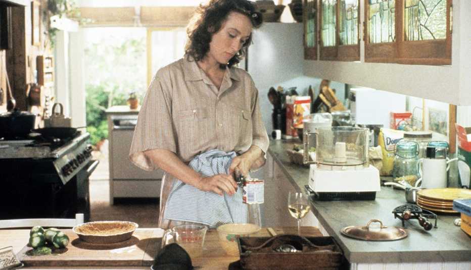 Meryl Streep as Rachel Samstat looking sad in a kitchen in a movie still from Heartburn 