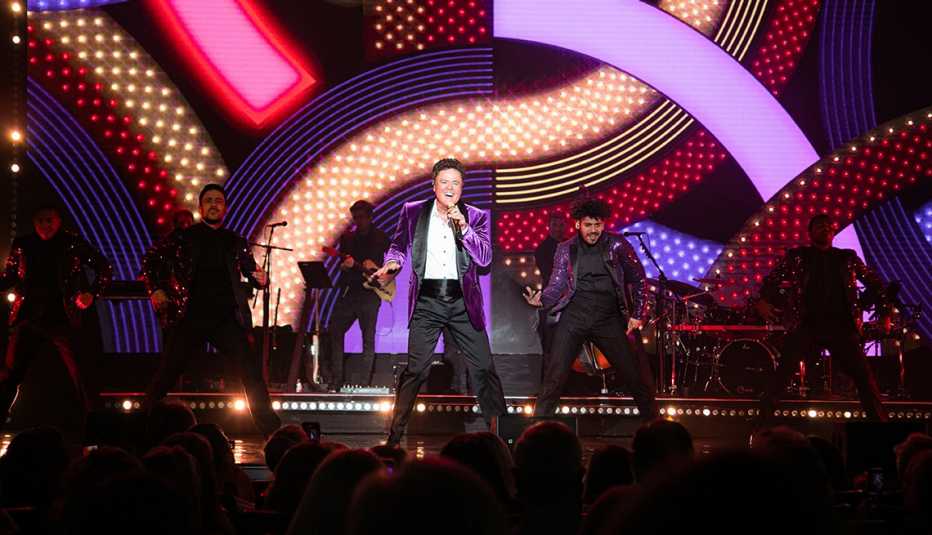 Donny Osmond performs on stage