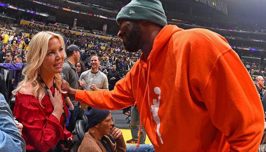 NBA Legend, Kobe Bryant speaks with President of the Los Angeles Lakers, Jeanie Buss during the Dallas Mavericks game against the Los Angeles Lakers on December 29, 2019 