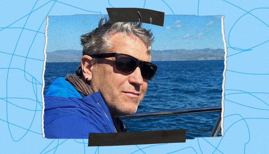 Black tape on top and bottom of a snapshot of Crai S. Bower wearing a winter coat while on a boat, blue water in the background. The photo is bordered by a blue background with squiggly lines.